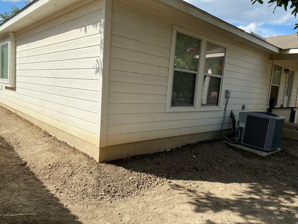 Engineer-led foundation pier installation on a Central Texas home near Helotes, TX