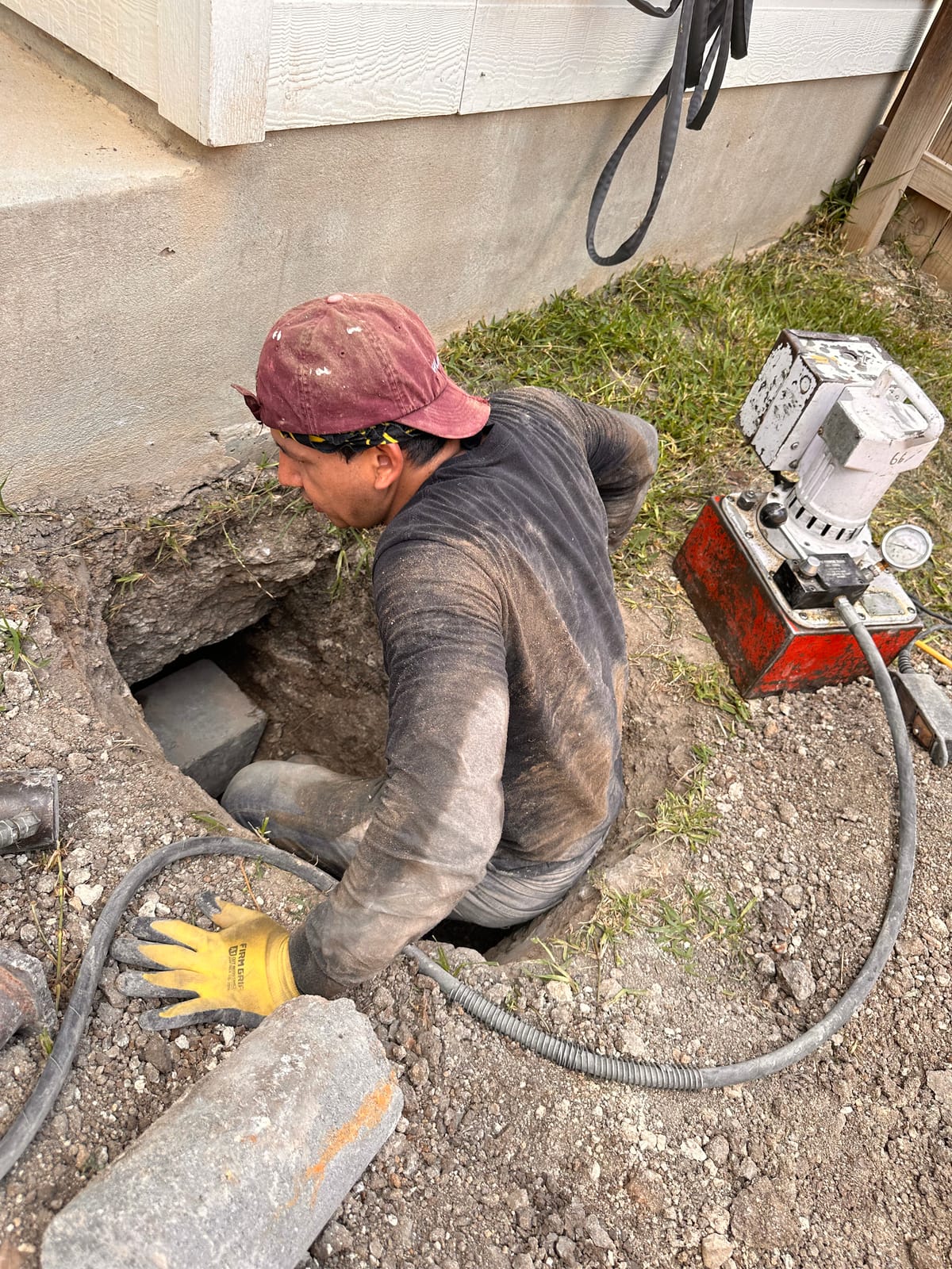 Engineer-led foundation pier installation on a Central Texas home near Manor, TX