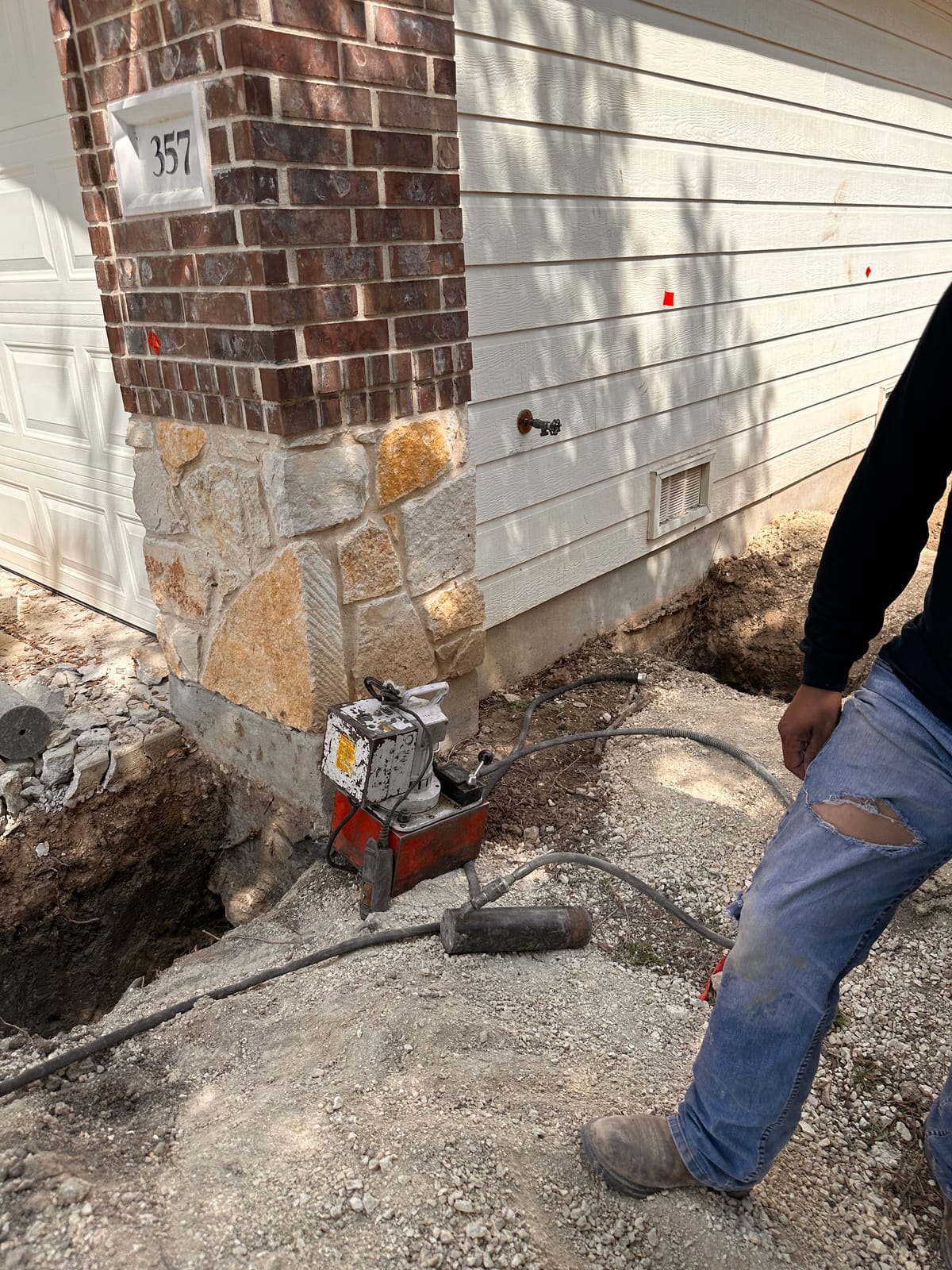 Engineer-led foundation pier installation on a Central Texas home near Seguin, TX