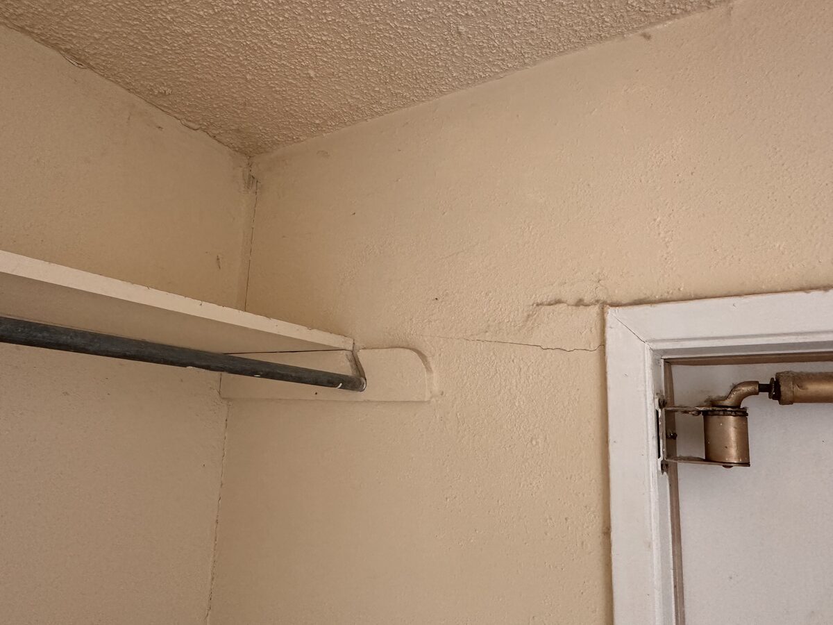 Settlement crack above a closet door frame, a common interior symptom of foundation movement
